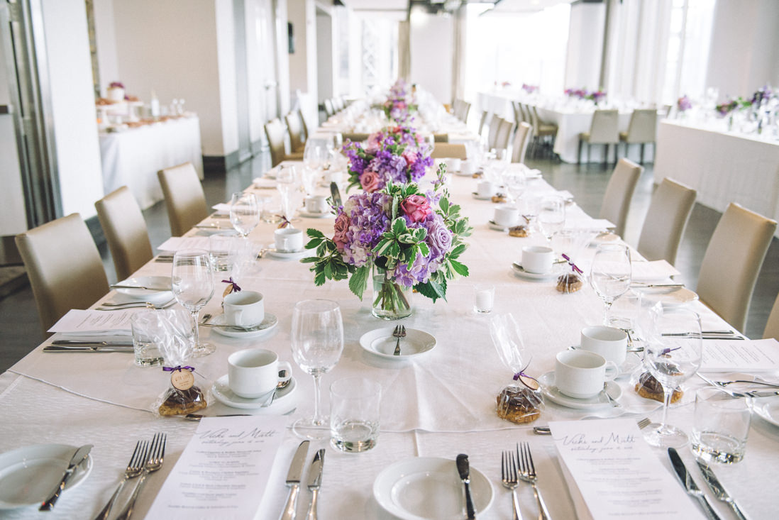 Purple centrepieces at wedding reception | Arcadian Loft Wedding, Toronto | EIGHTYFIFTH STREET PHOTOGRAPHY