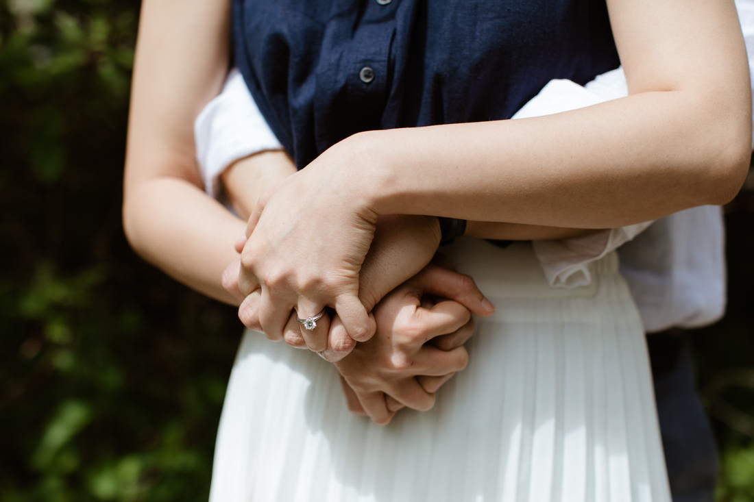 Close-up of Engaged couple's clasped hands | Toronto Wedding Photographer | EightyFifth Street Photography